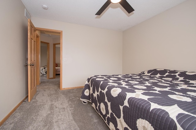 8075 211th Ave NW, Nowthen, MN 55330 - bedroom featuring carpet, baseboards, and ceiling fan