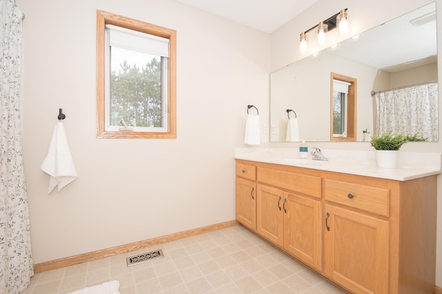 8075 211th Ave NW, Nowthen, MN 55330 - bathroom featuring vanity and baseboards