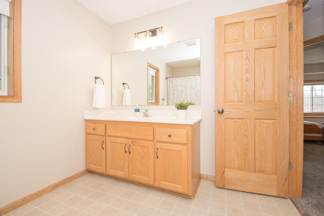 8075 211th Ave NW, Nowthen, MN 55330 - bathroom with vanity and baseboards