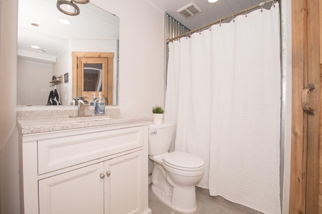 8075 211th Ave NW, Nowthen, MN 55330 - bathroom with toilet, vanity, recessed lighting, tile patterned floors, and curtained shower