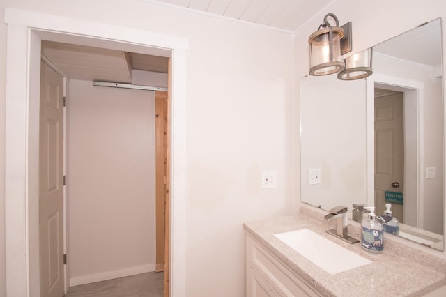 8075 211th Ave NW, Nowthen, MN 55330 - bathroom featuring vanity, wood ceiling, baseboards, and crown molding