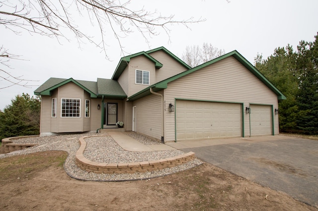 8075 211th Ave NW, Nowthen, MN 55330 - view of front of property featuring driveway and a garage