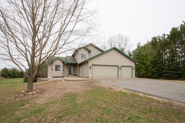 8075 211th Ave NW, Nowthen, MN 55330 - view of front of home with a garage and asphalt driveway