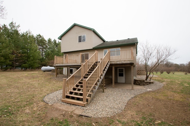 8075 211th Ave NW, Nowthen, MN 55330 - rear view of house featuring a wooden deck, stairs, and a yard