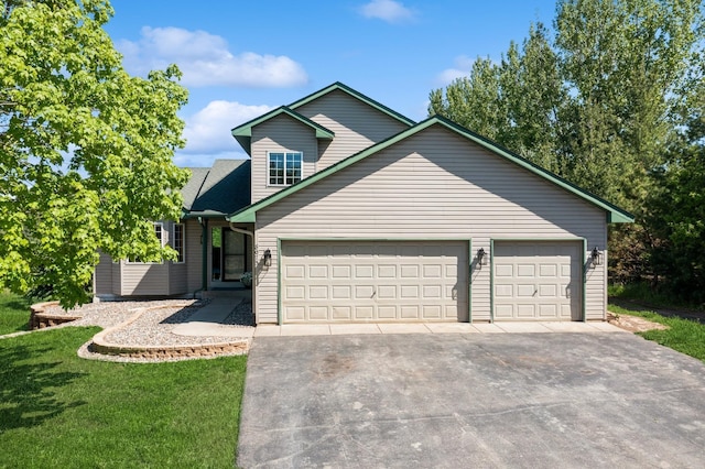 8075 211th Ave NW, Nowthen, MN 55330 - view of front of home with an attached garage, asphalt driveway, and a front yard