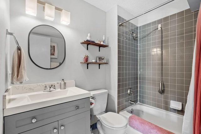 bathroom featuring toilet, vanity, and shower / bathtub combination with curtain