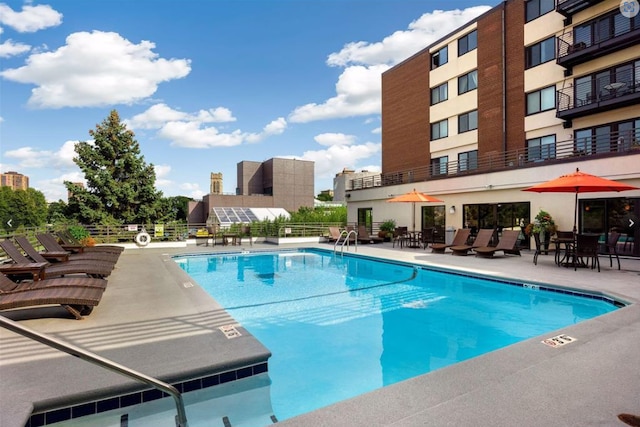 view of pool featuring a patio