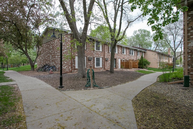 view of front of house featuring brick siding