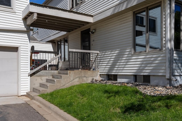 entrance to property featuring a garage