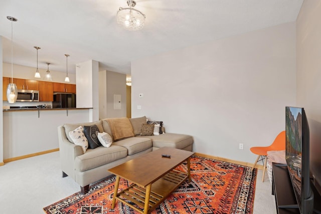 living room with light colored carpet and baseboards