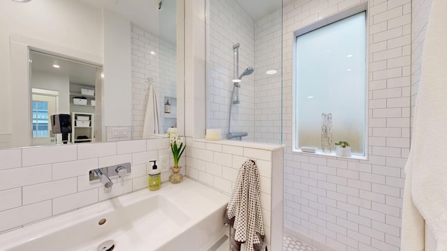 bathroom featuring decorative backsplash and a walk in shower