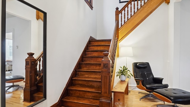 staircase with wood finished floors