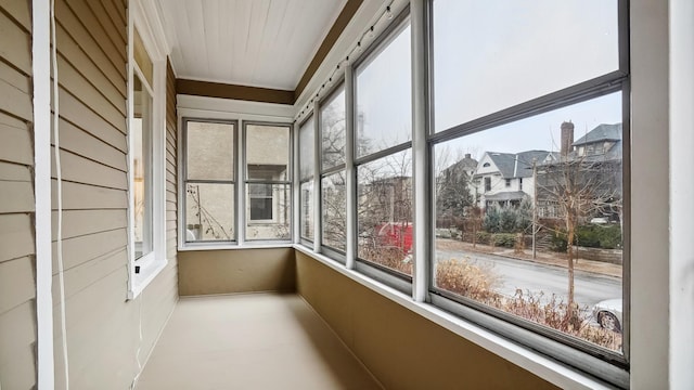 unfurnished sunroom with a residential view