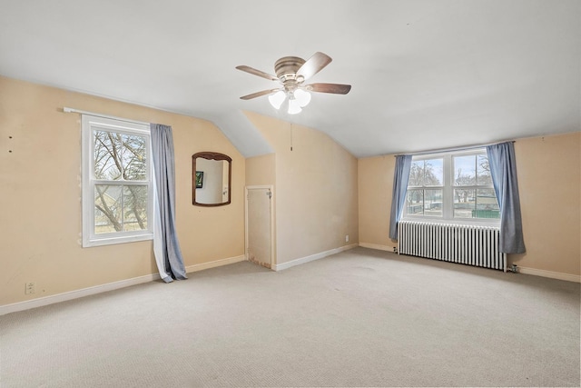230 Mcleod Ave W, Winsted, MN 55395 - additional living space featuring radiator, ceiling fan, carpet flooring, vaulted ceiling, and baseboards