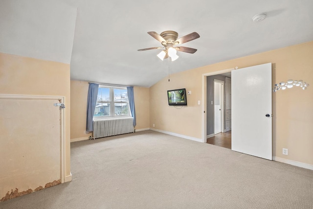 230 Mcleod Ave W, Winsted, MN 55395 - unfurnished living room with radiator, carpet flooring, ceiling fan, lofted ceiling, and baseboards
