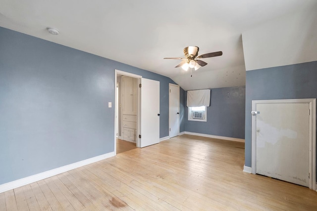 230 Mcleod Ave W, Winsted, MN 55395 - unfurnished bedroom with light wood-type flooring, lofted ceiling, baseboards, a ceiling fan, and cooling unit