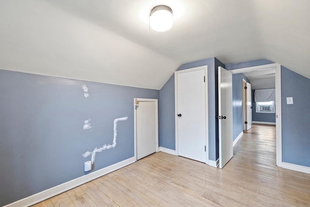 230 Mcleod Ave W, Winsted, MN 55395 - bonus room with wood finished floors, vaulted ceiling, and baseboards