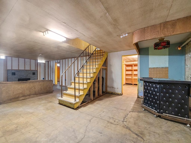 230 Mcleod Ave W, Winsted, MN 55395 - finished below grade area featuring stairs and a brick fireplace