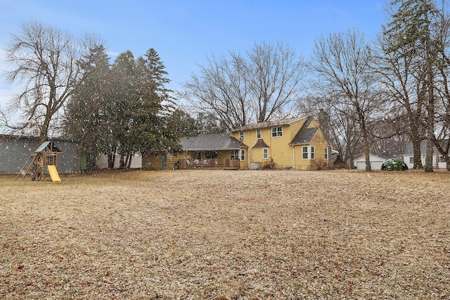 230 Mcleod Ave W, Winsted, MN 55395 - view of front of home with a playground and stucco siding