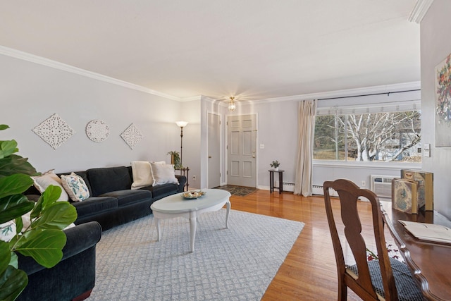 living room featuring ornamental molding and wood finished floors