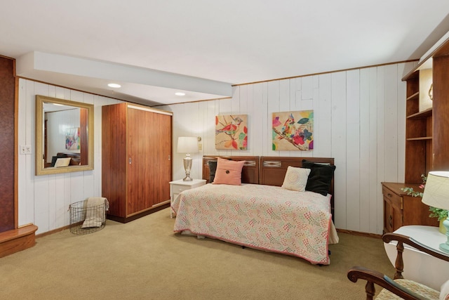 carpeted bedroom featuring baseboards