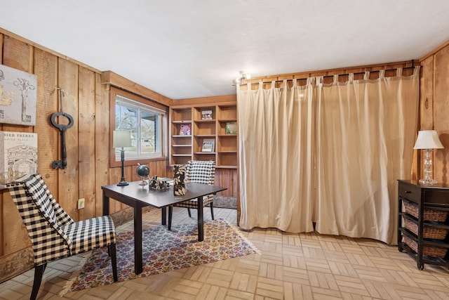 office featuring wood walls