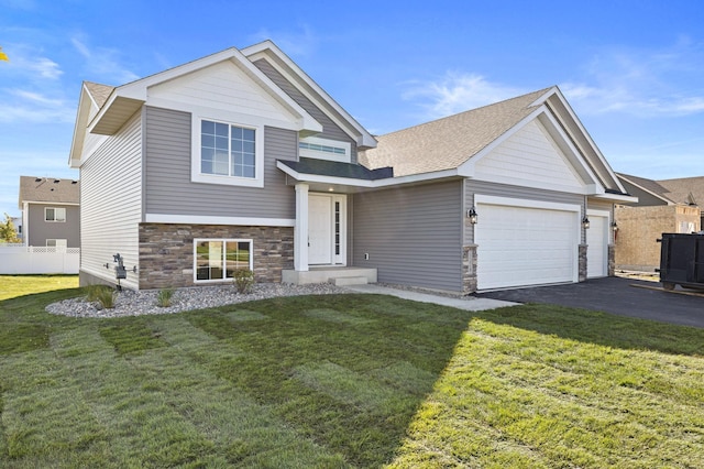 view of front of property featuring a garage and a front yard