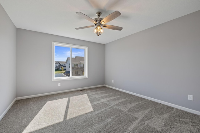 unfurnished room featuring carpet flooring and ceiling fan