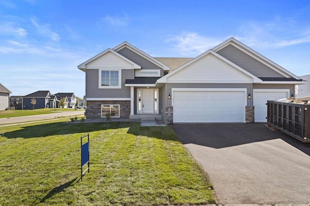 view of front facade with a garage and a front lawn