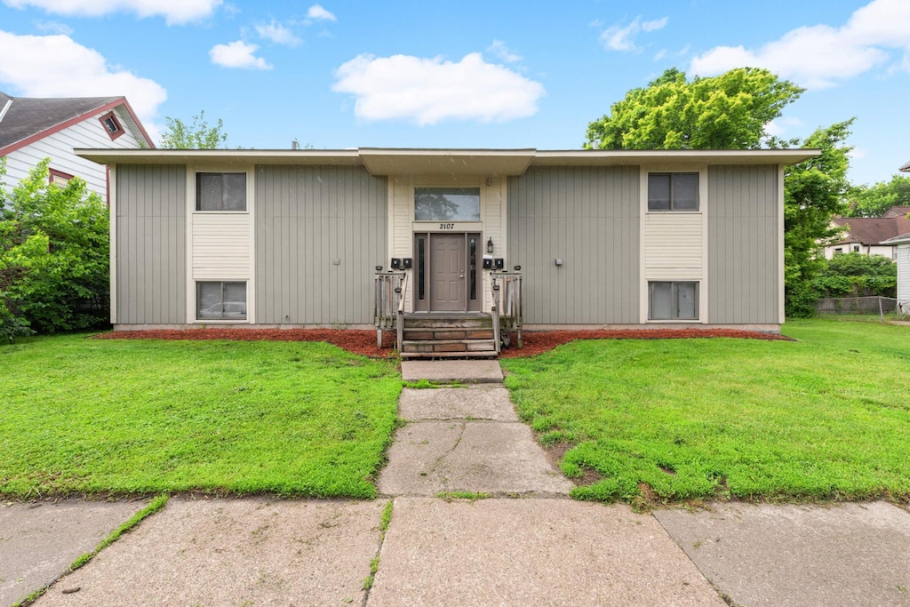 bi-level home with a front yard