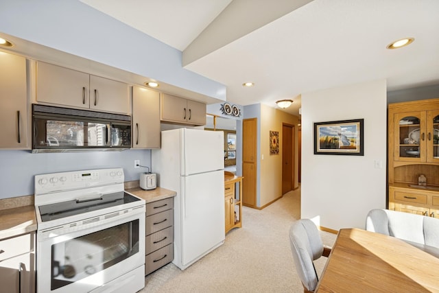 kitchen with light carpet, white appliances, light countertops, and recessed lighting