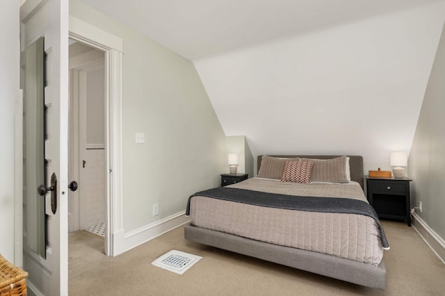 bedroom with carpet, visible vents, baseboards, and vaulted ceiling