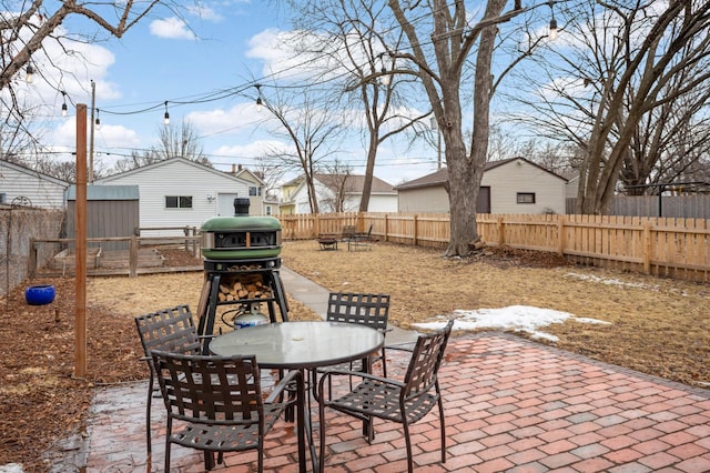 view of patio / terrace with outdoor dining space and a fenced backyard