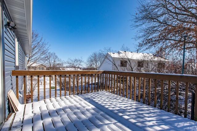 view of snow covered deck
