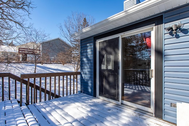 view of snow covered deck