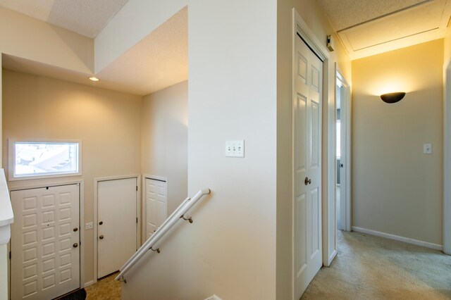 602 Cortland Ln SW, Rochester, MN 55902 - foyer featuring light carpet, baseboards, and recessed lighting