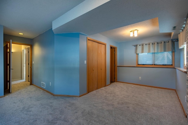 602 Cortland Ln SW, Rochester, MN 55902 - unfurnished bedroom featuring carpet flooring, a closet, and baseboards