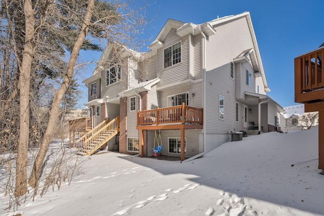 view of front of house featuring cooling unit and a deck