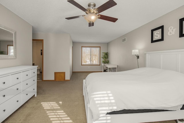 bedroom with ceiling fan and light colored carpet