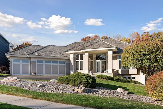 prairie-style home featuring a garage