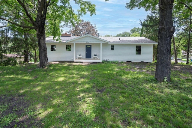 back of house featuring a porch and a lawn