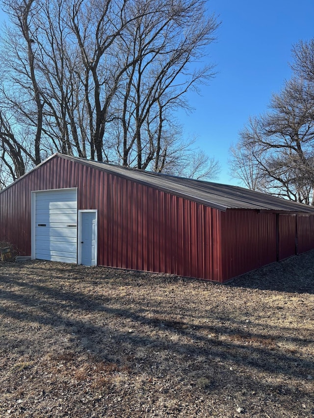 view of outbuilding with an outbuilding and driveway