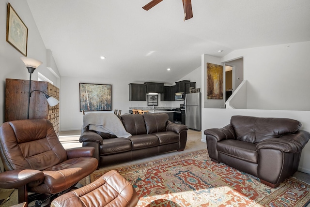 living room featuring lofted ceiling, ceiling fan, recessed lighting, and light colored carpet