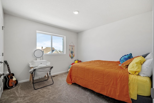 bedroom with carpet and baseboards