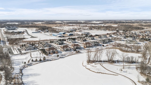 snowy aerial view featuring a residential view