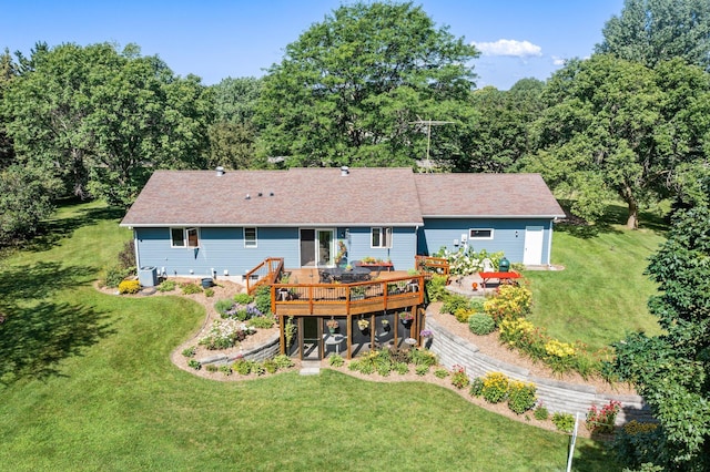 back of house with central AC, a yard, and a wooden deck