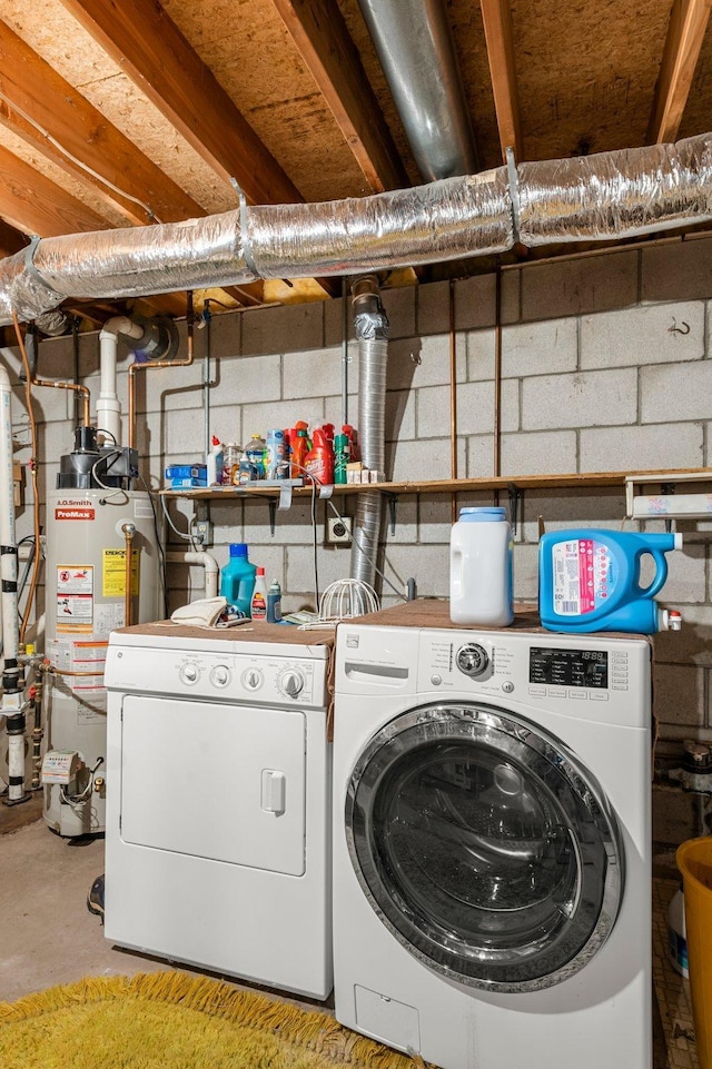 washroom with water heater, laundry area, and independent washer and dryer