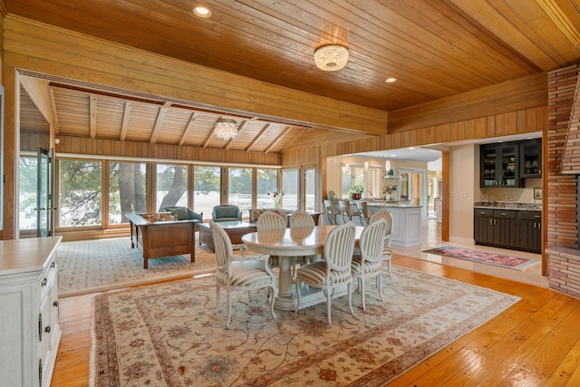 dining space with recessed lighting, wood ceiling, vaulted ceiling, and light wood-style flooring