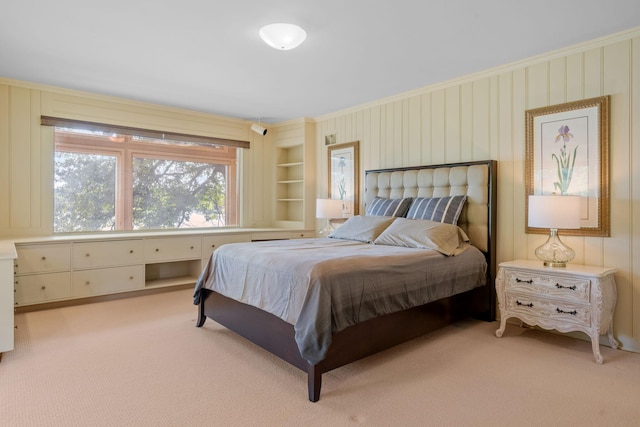 bedroom featuring light carpet and crown molding