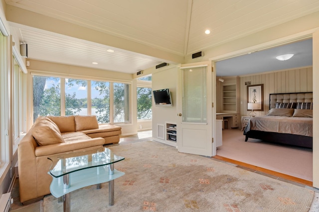 carpeted living room featuring crown molding, built in features, and recessed lighting